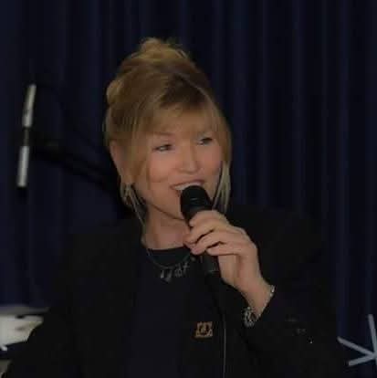 Barbara Montgomery speaking into a microphone